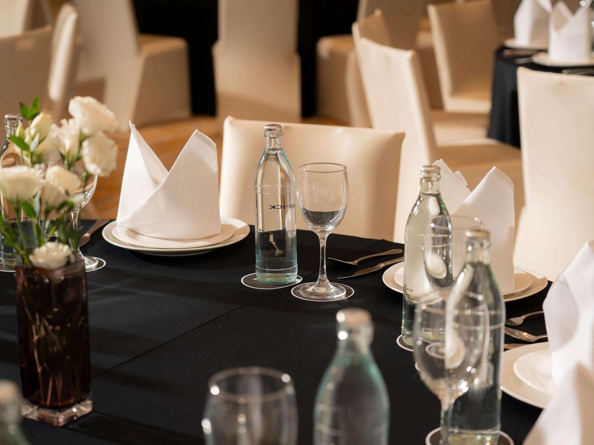 Moevenpick Myth Hotel Patong Phuket Exterior photo A table set for a formal dinner